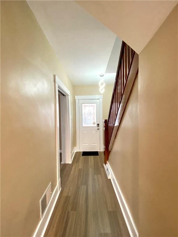 interior space with dark hardwood / wood-style flooring