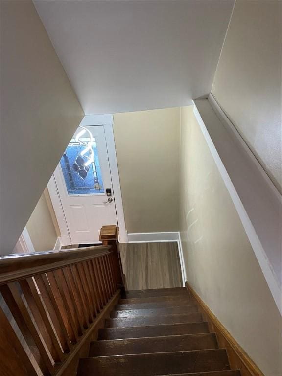 staircase featuring hardwood / wood-style floors