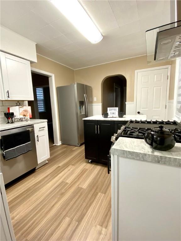 kitchen featuring white cabinetry, appliances with stainless steel finishes, and light hardwood / wood-style floors