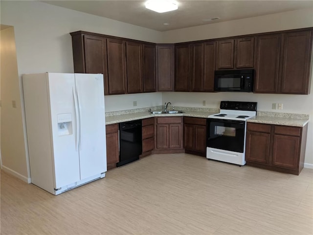 kitchen with dark brown cabinets, sink, and black appliances