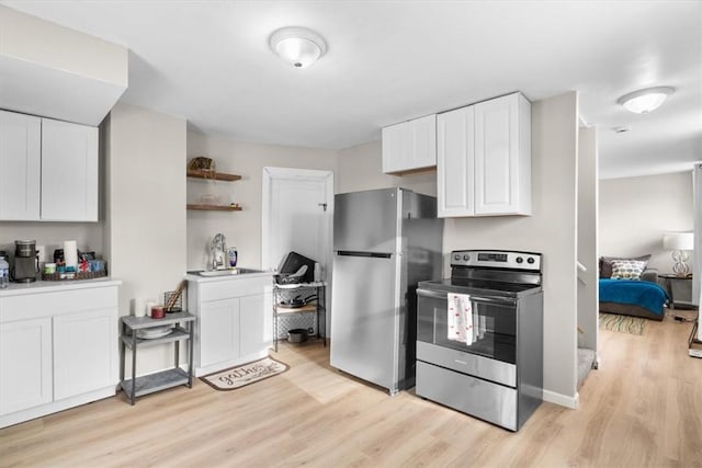 kitchen featuring sink, stainless steel appliances, white cabinets, and light wood-type flooring