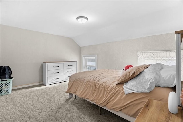 carpeted bedroom featuring lofted ceiling