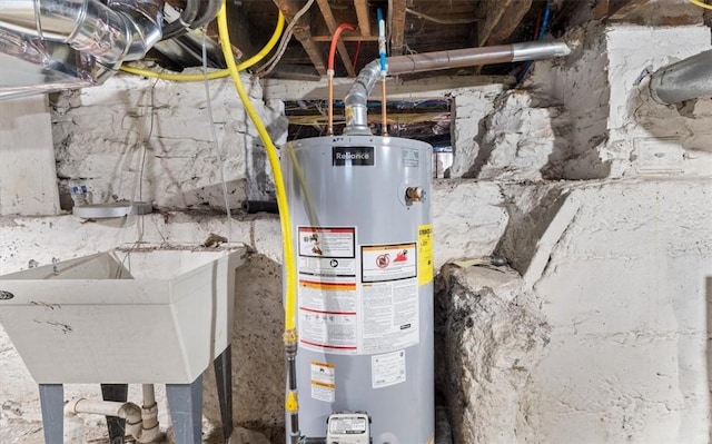 utility room featuring sink and gas water heater