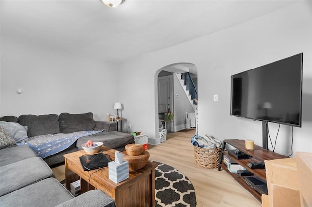 living room with light hardwood / wood-style flooring