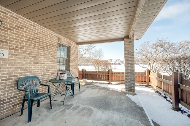 view of snow covered patio