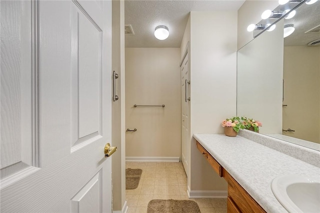 bathroom featuring vanity and a textured ceiling