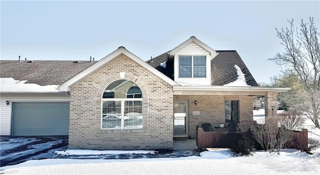 view of front of house with a garage and a porch