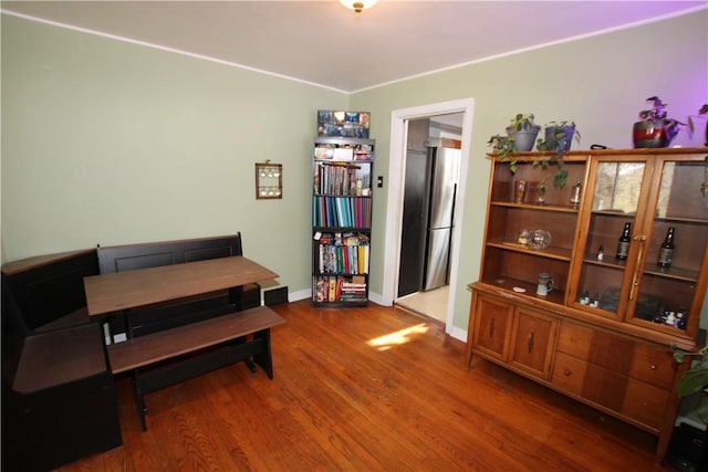 dining room with dark hardwood / wood-style flooring