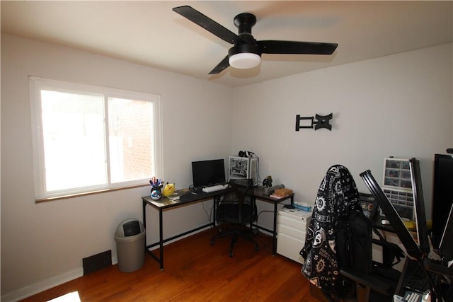 office space featuring dark hardwood / wood-style floors and ceiling fan