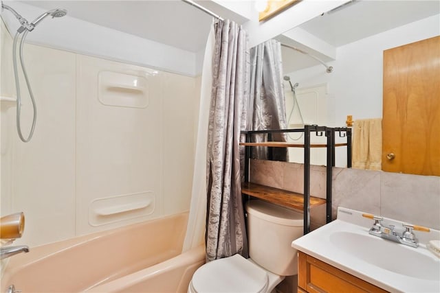 full bathroom featuring tasteful backsplash, vanity, shower / tub combo with curtain, and toilet