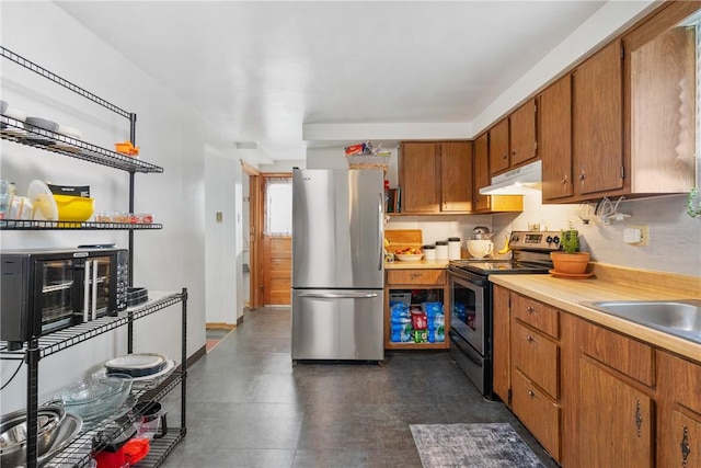 kitchen with sink and appliances with stainless steel finishes