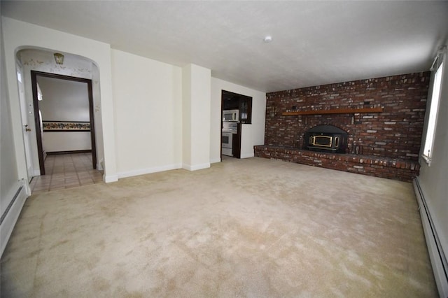 unfurnished living room with light carpet and a baseboard radiator