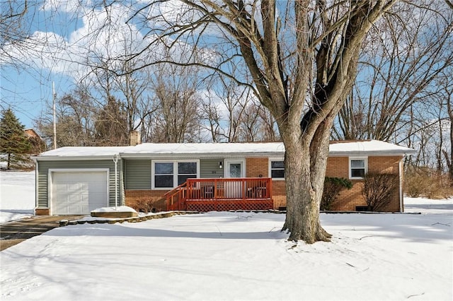 ranch-style home with a wooden deck and a garage