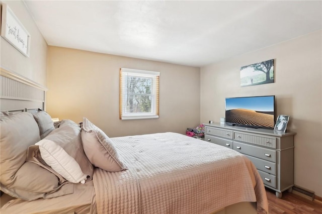 bedroom with hardwood / wood-style floors