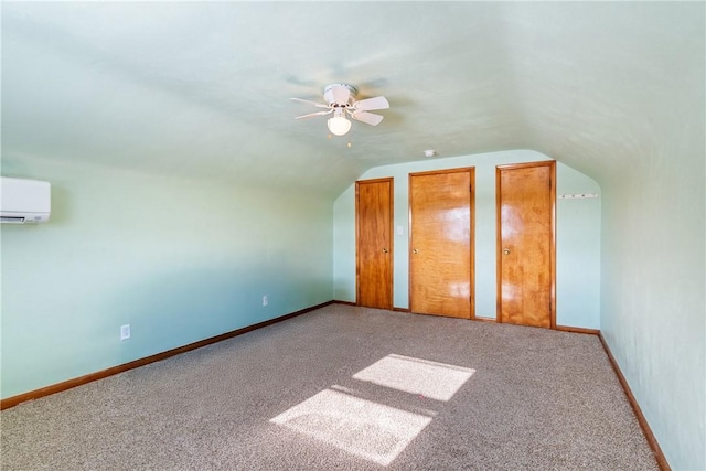 bonus room with ceiling fan, lofted ceiling, carpet floors, and a wall unit AC