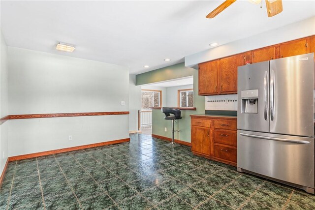 316 Noll Rd, Hanover Twp Bea, PA 15043 - kitchen with brown cabinetry, ceiling fan, stainless steel fridge with ice dispenser, and baseboards