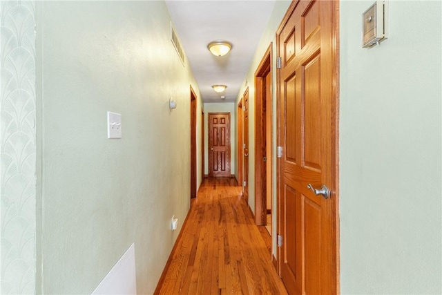 hall featuring light wood-type flooring