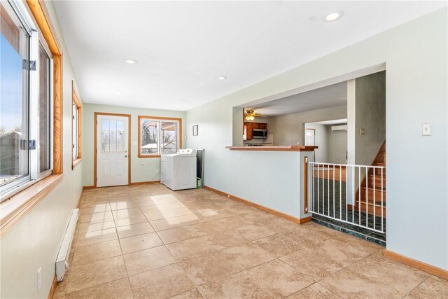 316 Noll Rd, Hanover Twp Bea, PA 15043 - laundry room featuring baseboards, a ceiling fan, a baseboard heating unit, and laundry area