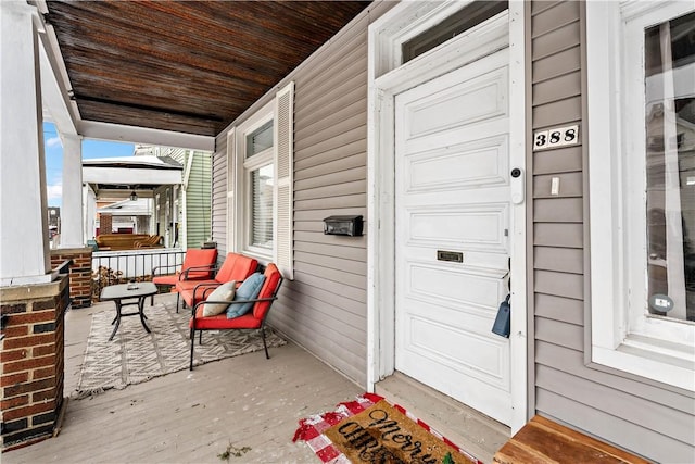 wooden terrace featuring a porch