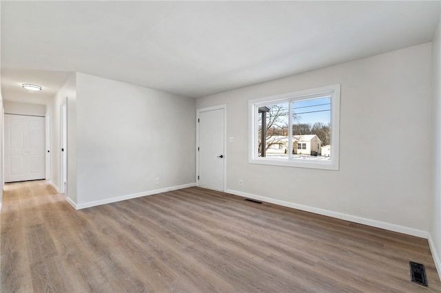 unfurnished room featuring wood-type flooring