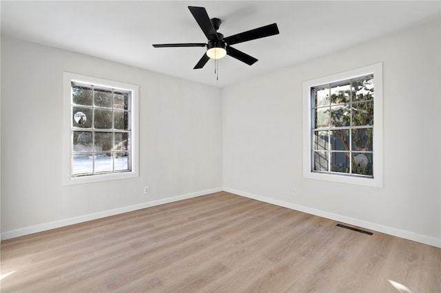 unfurnished room featuring ceiling fan and light wood-type flooring