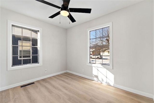 unfurnished room with light hardwood / wood-style floors and ceiling fan