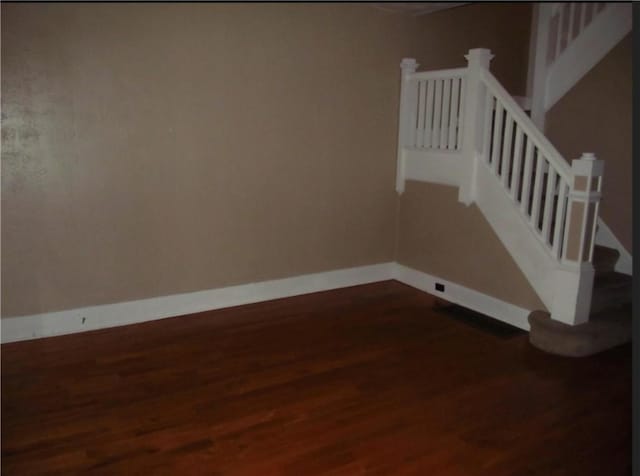 staircase featuring hardwood / wood-style floors