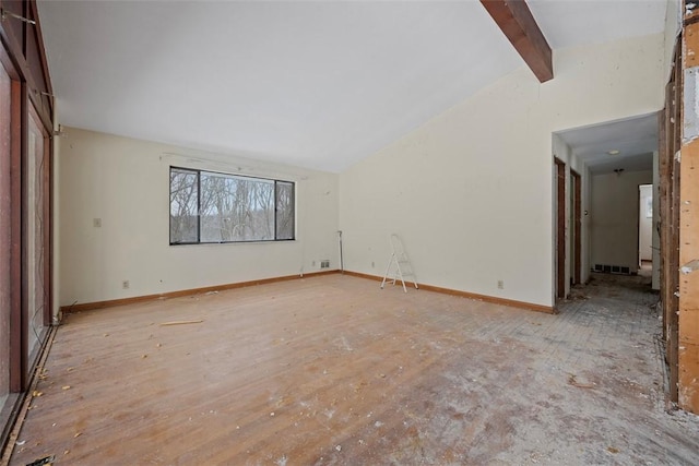 unfurnished living room featuring lofted ceiling with beams