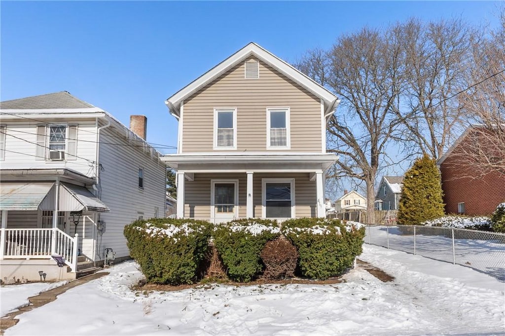 view of front property featuring covered porch