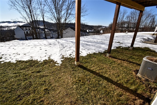 snowy yard with central AC unit