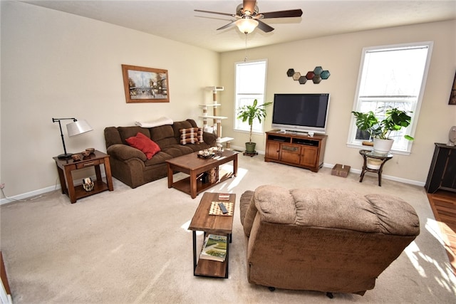 carpeted living room featuring ceiling fan