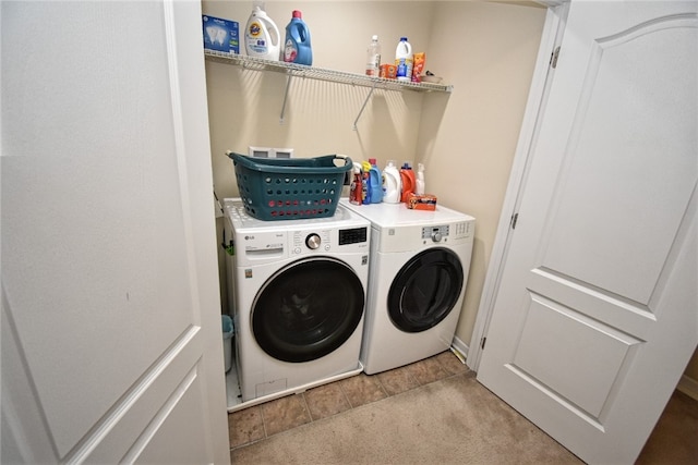 clothes washing area with carpet and washing machine and clothes dryer