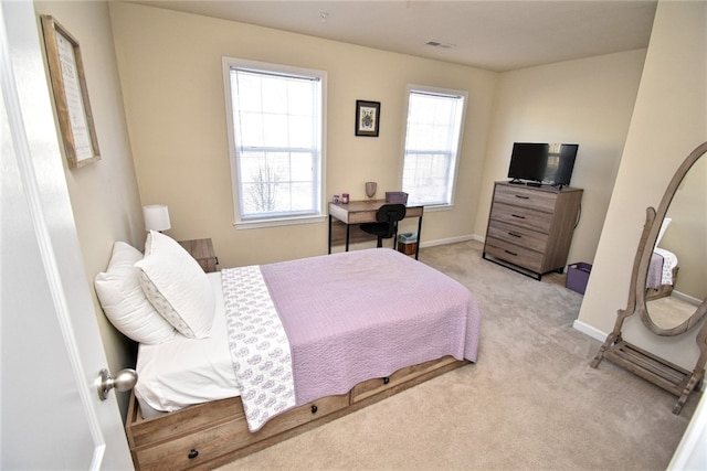 bedroom featuring light colored carpet