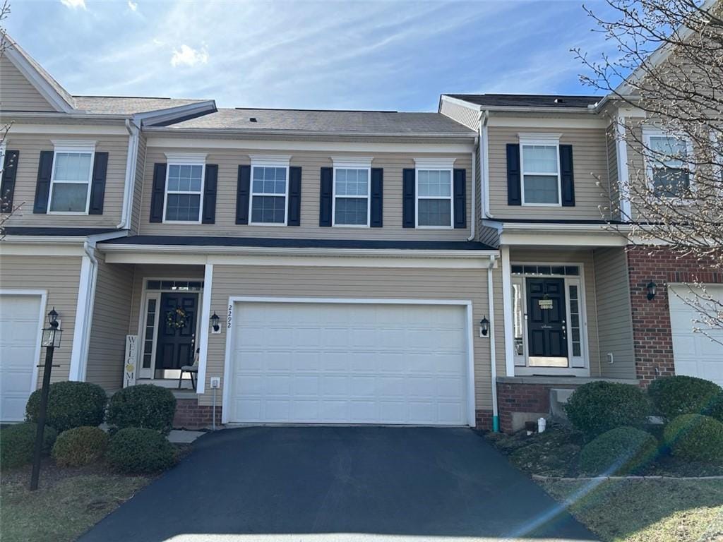 2292 Flint Dr, South Strabane, PA 15301 - townhome / multi-family property featuring aphalt driveway and an attached garage