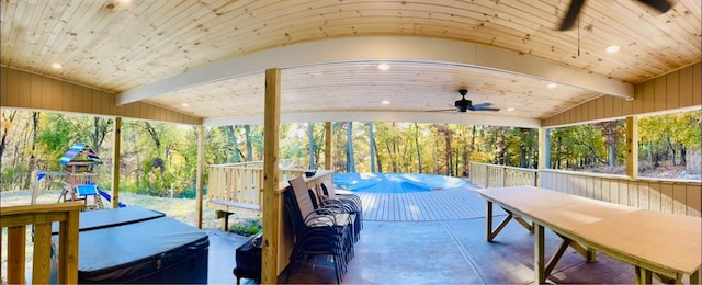 exterior space with lofted ceiling and ceiling fan