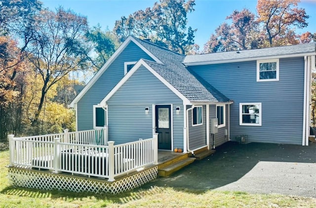 rear view of house with a wooden deck