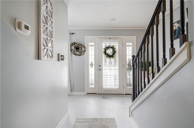 entryway featuring ornamental molding