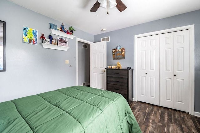 bedroom with ceiling fan, dark hardwood / wood-style flooring, and a closet