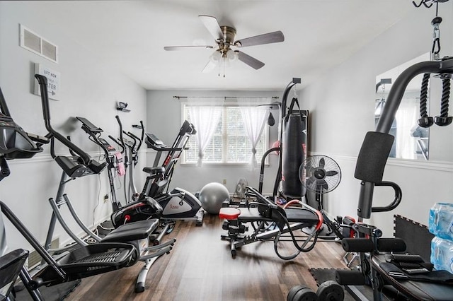 workout area featuring hardwood / wood-style flooring and ceiling fan