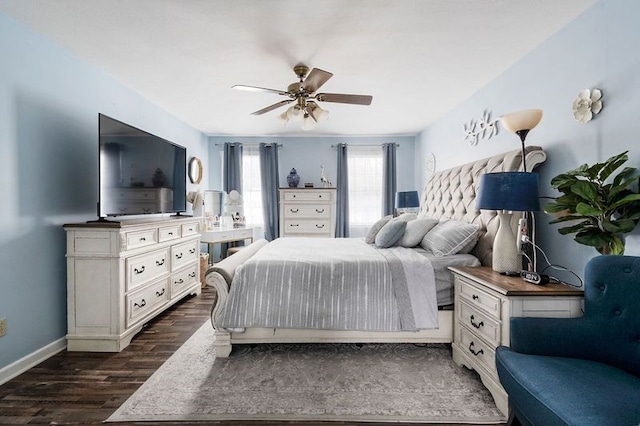 bedroom with ceiling fan and dark hardwood / wood-style floors