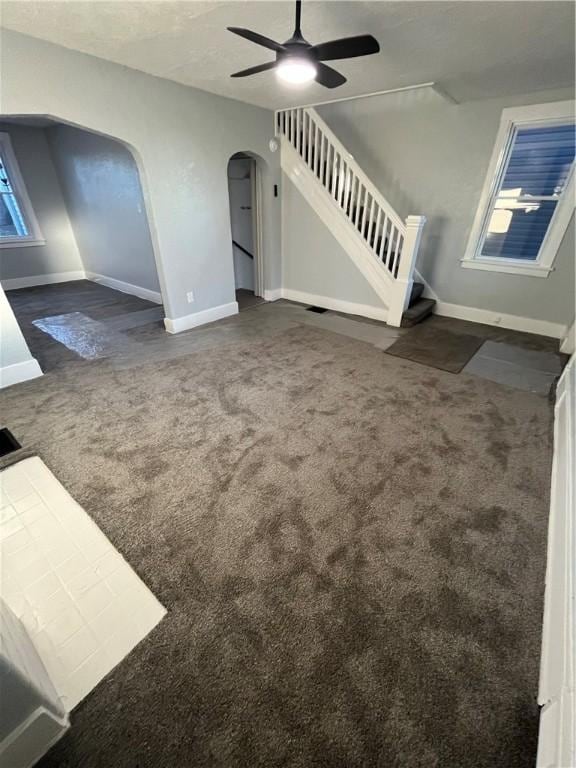 carpeted living room featuring ceiling fan