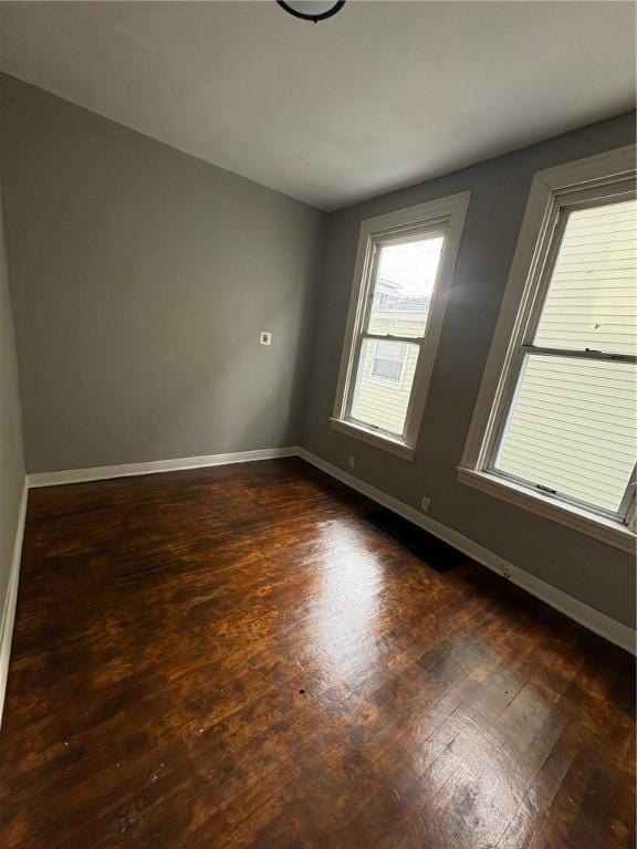 empty room featuring dark hardwood / wood-style floors