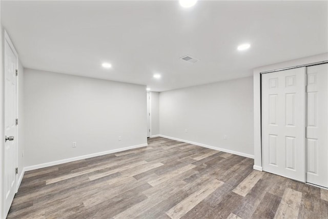 basement featuring wood-type flooring