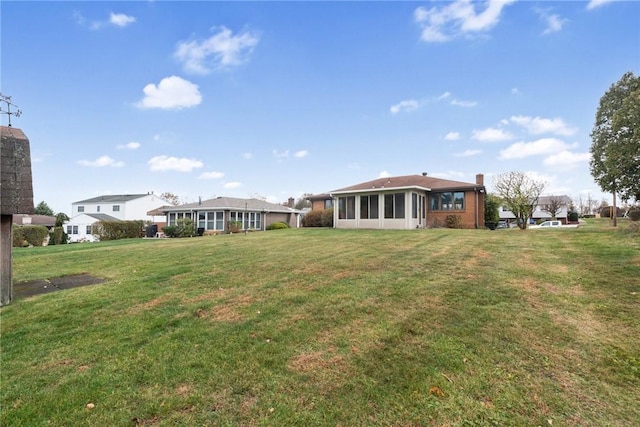 view of yard featuring a sunroom