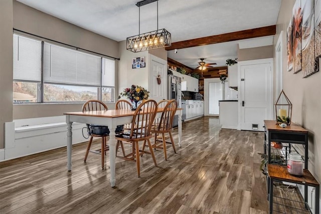 dining room featuring dark wood-type flooring and ceiling fan