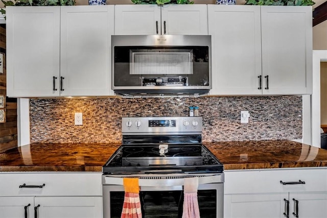 kitchen with white cabinetry, appliances with stainless steel finishes, and decorative backsplash