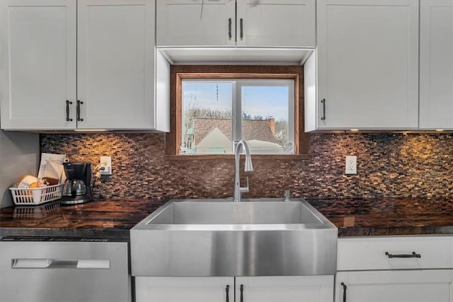 kitchen with white cabinetry, dishwasher, sink, and backsplash