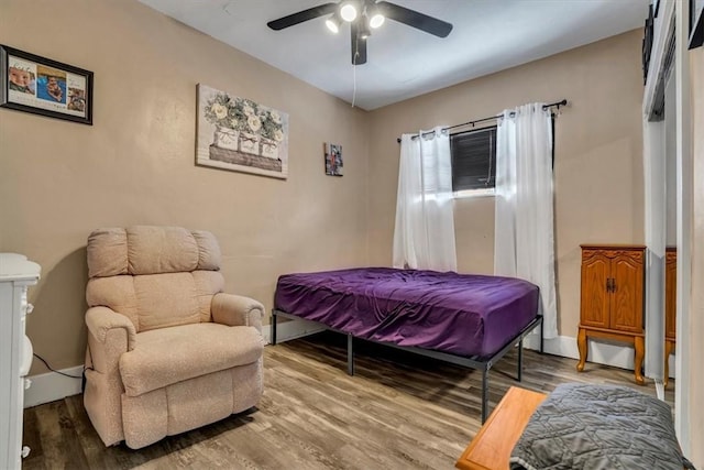 bedroom featuring hardwood / wood-style flooring and ceiling fan