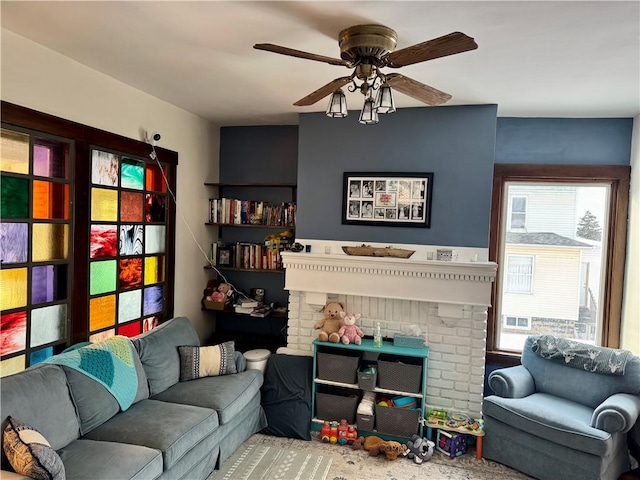 living room with a healthy amount of sunlight and ceiling fan