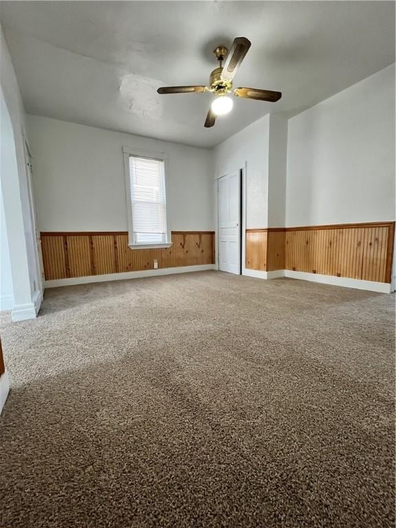 carpeted empty room with ceiling fan